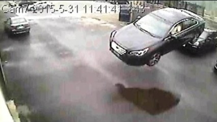 Caught on video: Airborne Car Crashes into Building
