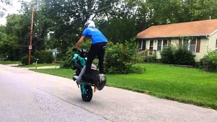 Couple Pulls Off Dangerous Motorcycle Stunt