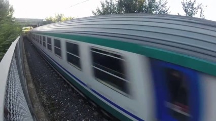 Crazy Ass Kid Lays Down UNDER a Passing Train!