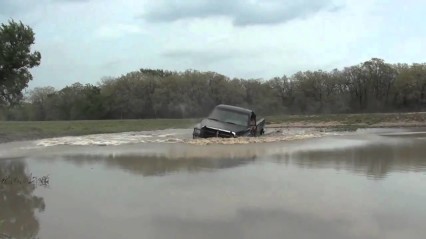 Crazy Guy Jumps His Dodge Ram 2500 Into a Lake