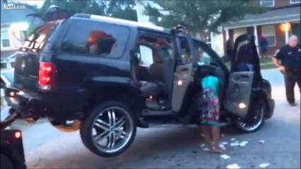 Crazy Woman Tries To Drive Off In Her Escalade While Being Towed!