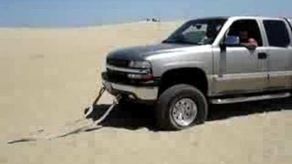 Fully Loaded Ford Truck Pulls Chevy Truck Out of the Sand!