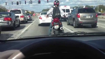 Street Biker Popping Locking and Dropping It, At A Red Light!