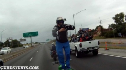 Insane Guy Stands Backwards on his Motorcycle on The Highway