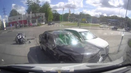 Motorcycle Rider Lands Between Two Crashing Cars – Somehow Survives