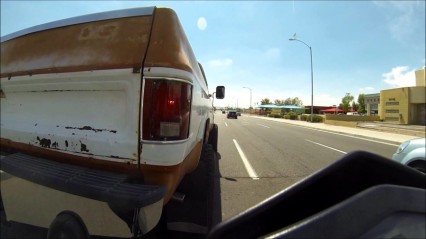 Motorcycle Rider Pushes Stranded Chevy Truck to Gas Station