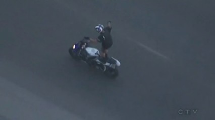Motorcyclist Does Stunts During High-Speed Chase