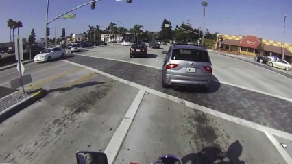 Motorcyclist Scares Driver for Running Red Light