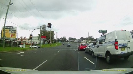 Police Car causes 3 Car Crash – DISTRACTED DRIVING!