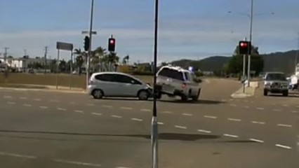 Police Car Crashes Responding Through Red Light