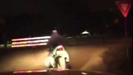 Policeman Kicks Off Motorcyclist After Chase!