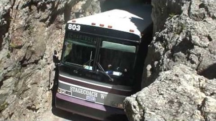 Rock In A Hard Place – Charter Bus Squeezes Through Rock Tunnel