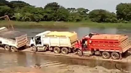 Trucks Fall Off Barge Into River