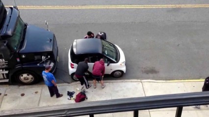 When a Smart Car is in the Way Just Lift it up and MOVE IT!