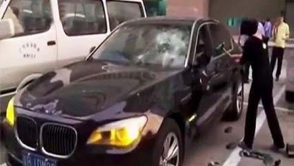 Woman RUINS $200,000 BMW With a Hammer After Alleged Affair