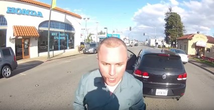 Crazy Guy Punches Motorcyclist: Road Rage