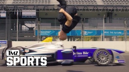 Crazy Video! Freerunner Backflips Over Speeding Formula E Car