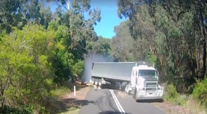 SEMI Truck Comes Flying Down A Hill Sideways! CLOSE CALL