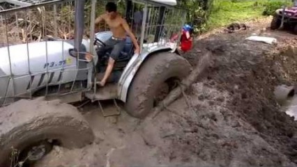 Tractor Stuck in the Mud Uses Creative Way to Get Unstuck