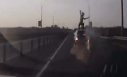 Rider Rear Ends Car – Lands Perfectly on His Feet… On the Roof of the Car!
