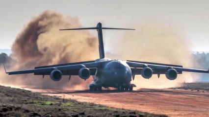 IMPRESSIVE C-17 Dirt Airstrip Landing & Takeoff, Unloads AH-64 Helicopter