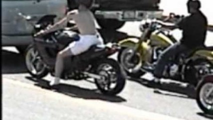 Squid Motorcycle Rider Crashes into Car While Trying to Show Off