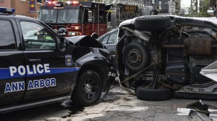 Cop Runs Red Light and Causes Rollover Crash