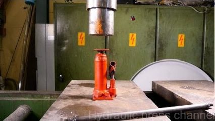 Testing the strength of a bottle jack with a 100-ton hydraulic press
