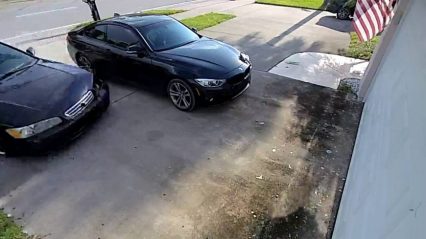 Epic drift into a garage goes horribly wrong as man plows through garage door