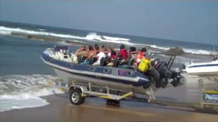 How to launch a boat on the beach with a tractor