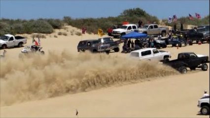 One bad twin turbo K5 Blazer hammers down on a nitrous C10 truck at the dunes