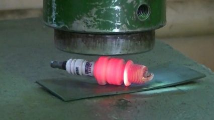 This is how well a spark plug holds up against a hydraulic press