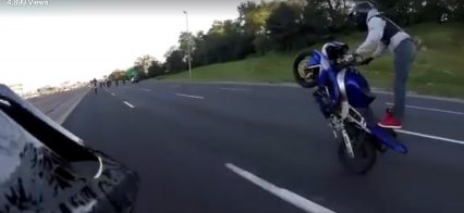 When wheelies go bad! Rider loses talent and goes tumbling down the highway