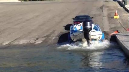 Chevrolet Corvette pulls a boat out of the water