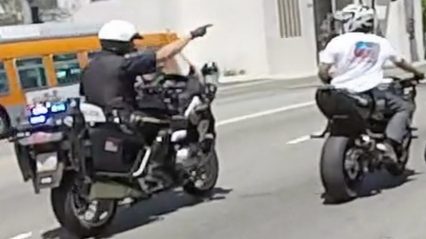 Did this cop just cause a group of riders to crash? Or is this instant karma?