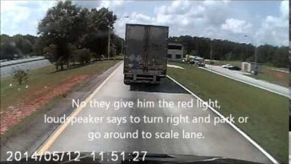 SEMI truck driver picks the worst time to make a U-turn