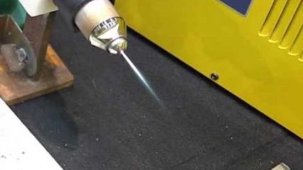 This plasma light saber uses water to cut through steel