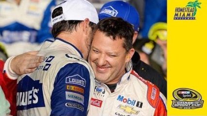 Jimmie Johnson and Tony Stewart share a moment on the night of Stewart’s last race