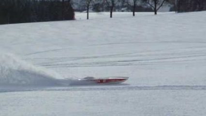 RC powerboat driving on fresh powder snow with ease