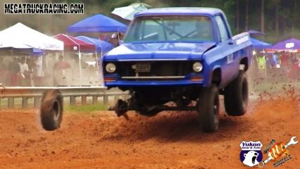 Mud trucking like a boss! Guy loses a wheel and keeps going!