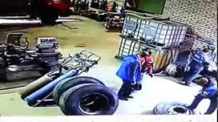 Security Camera Captures SEMI Truck Tire Blowing Up in a Shop