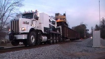 Truck Towing a Train! Brandt Railroad Truck Towing a Heavy Load on Train Tracks!