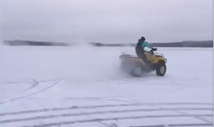 Man Whipping 360s in His ATV in the Snow Crashes Hard
