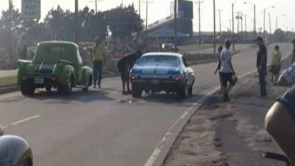 Big Chiefs Old Chevelle vs Green Truck on the Street