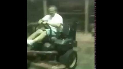 This Guy Driving an Out of Control Lawn Mower Will Make Your Day