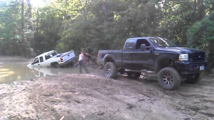 Ford F250 Pulling a Chevy Truck out of Some Deep Mud