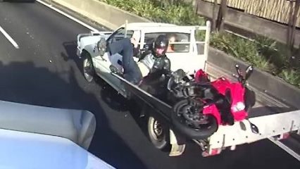 Motorcycle Rider Not Paying Attention Crashes, Lands on Truck