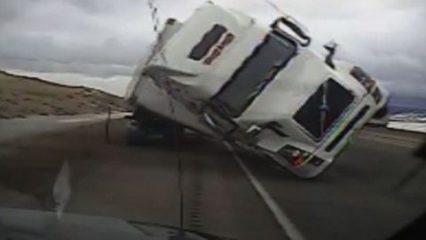 SEMI Truck in High Winds Blows Over and Crushes Patrol Car