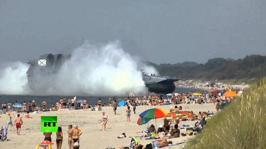 Huge Amphibious Landing Craft Docks at Crowded Beach in Russia