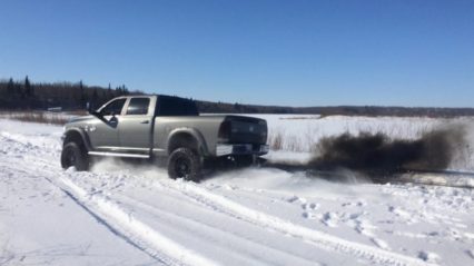 Lifted Dodge Cummins Pulls Out Stuck Chevy Truck in the Snow